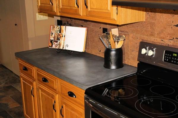 Charcoal Gray concrete countertop, stove piece.