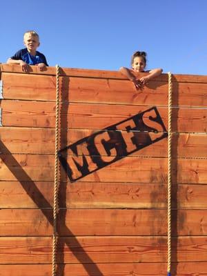 Our 8 foot wall with climbing ropes on one side and rock wall on the other side