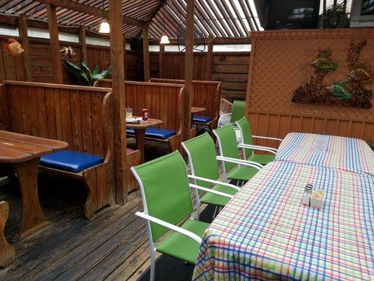 Outdoor covered deck-style dining - comfortable and lots of light. Other options - outdoor uncovered patio, indoor barroom and dining room.