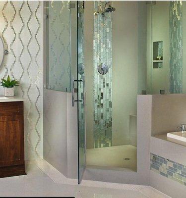 Luxury Bathroom!
Featuring: Pearla Bianca flooring, tub surround and shower walls. Subway Pearl mosaic backsplash and custom mosaic wall