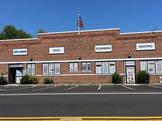 The outside of our building. Enter on left. 
 Plumbing Supply
 HVAC Supply
 We Deliver.
