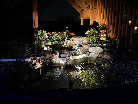 Koi pond waterfall by night