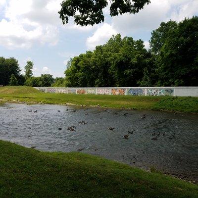 just a short stroll from the park is the Cardinal Greenway Trail and murals