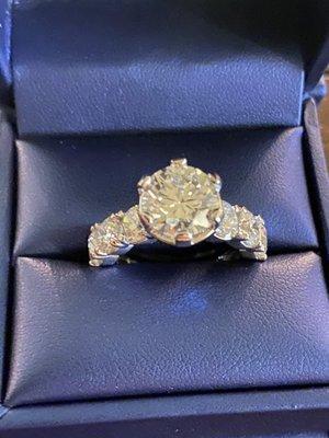 6.28 Total Diamond Ring. 3.28 in the center and 3 total on the side diamonds.