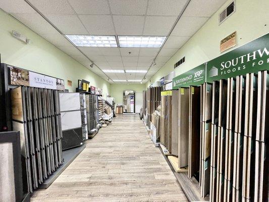 LVP/LVT/Laminate section- from brands like Coretec, Stanton, Southwind, Floors Plus, Shaw, Bruce, Beau, Metroflor, QuikStep.