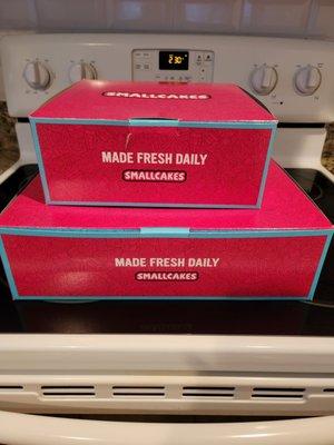 Boxes of Christmas  cupcakes.