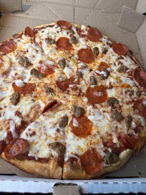 Meat pizza with pepperoni and sausage