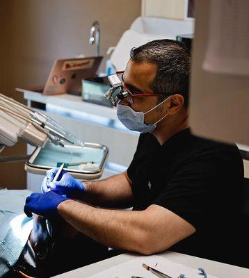 Dr. Amir Hassan working on a patient.