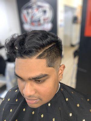 Skin fade with a hard part