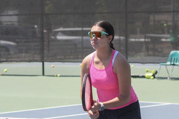 A camper being ready to play a point