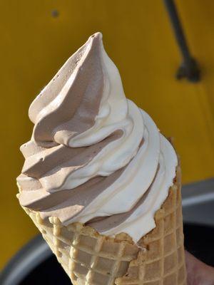 Close-up of the Vanilla Chocolate Twist Frozen Custard inside a large Waffle Cone.