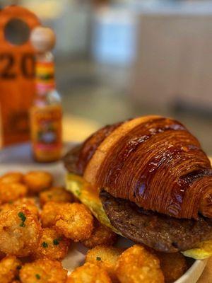 Croissant breakfast sandwich with sausage