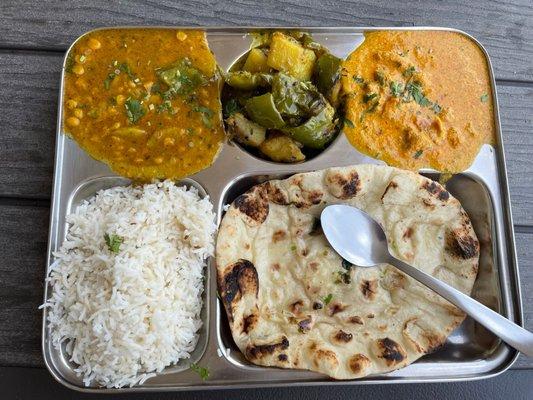 Lentils, potatoes and green peppers, Butter Chicken Curry below: Rice and Garlic Naan