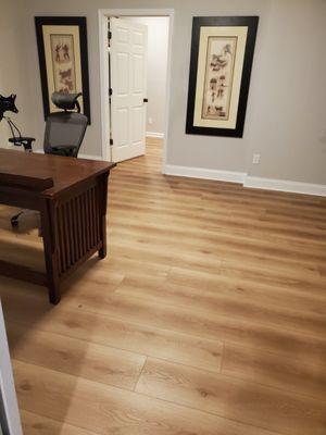 New hybrid, waterproof flooring. Available from multiple manufacturers. Thicker than luxury vinyl. More durable than hardwoods.