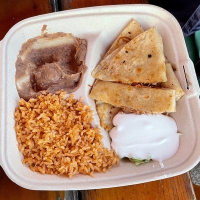 Corona's Mexican Food. Chicken Quezadilla plate with rice, refried beans, guacamole and sour cream ($10).