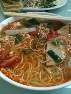 Special #7, tomato based noodle soup with crab meat, fish cake and shrimp