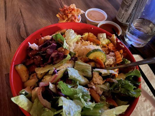 Spicy Chicken Bibimbap Bowl, after partial mixing. Spicy Kimchi & sauces in back.