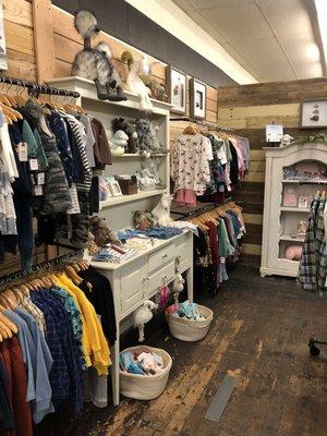 Assortment of boy's and girl's clothes and gifts.