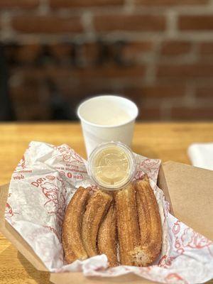 TRADITIONAL CHURROS W/ICE CREAM (CHURROS CON N/EVE): Topped w/1 scoop of Ice Cream + 1 Drizzle Flavor | $9.75 (5pcs-5")