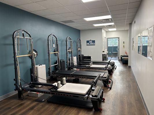 RB Pilates Class Studio with 4 Reformer/Tower Pilates machines.