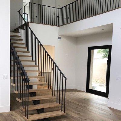 Custom staircase and railing painted by us!