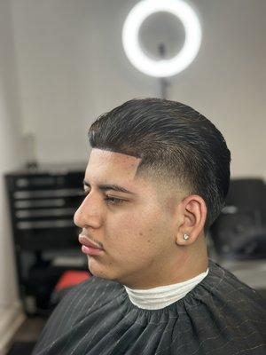 Gentlemen's cut with a high taper.