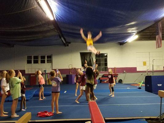 Titan cheerleaders working even on sleepovers! See who can get the highest basket toss! #gotitans