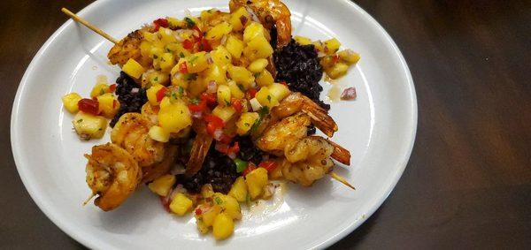 Grilled shrimp skewers, coconut black rice, pineapple salsa,citrus butter