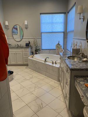 Wiped down light fixtures, countertops, shined copper sinks bath tub and floors
