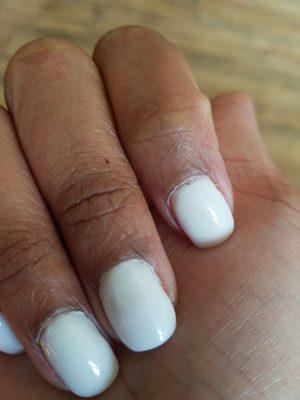 Most nails are not even, middle finger is the worst...nail tech rushed through the process on a slow day.