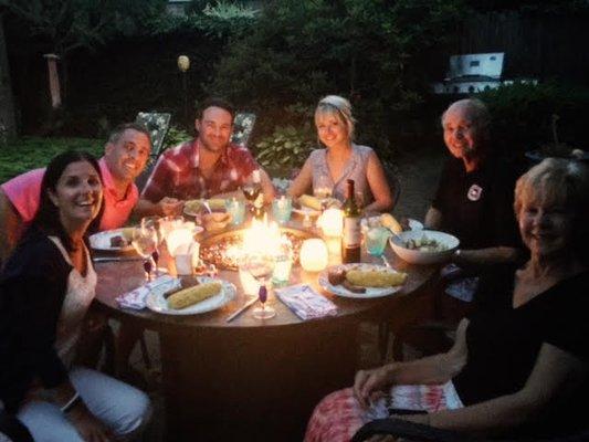 The Williams family of Newport enjoying their O.W. Lee Fire Table from Bristol Patio.