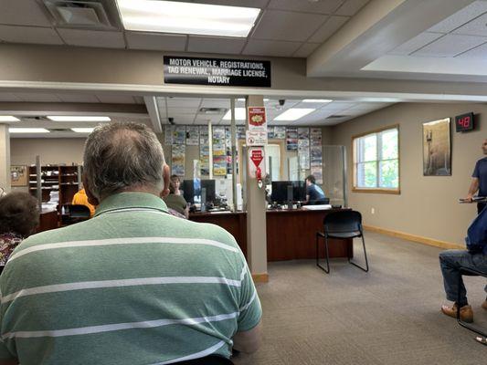 Twenty-five people ahead of me in line; clerks office needs longer hours and six days a week.