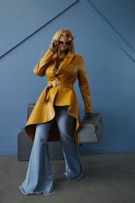 Me in my Bougie Gurlz mustard coat and acid wash bell bottom jeans