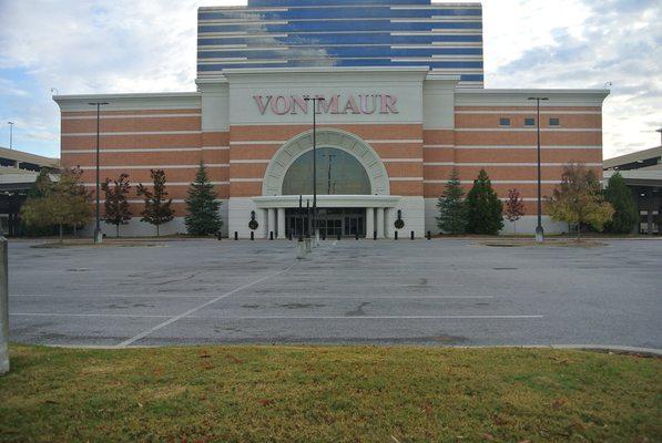 Tall building behind Von Maur. Drive up into the parking deck located behind Von Maur. Office located on 5th floor