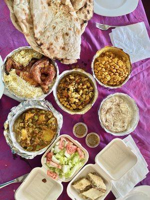 Moshakal vegetables, grilled chicken wjth rice, gallaba chicken, white beans with egg, baqlawa dessert, flatbread, and salad