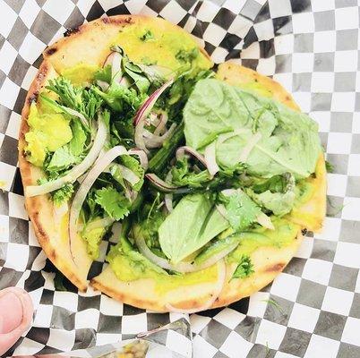 Avocado Flatbread featuring five different fresh herbs, edamame and Argentinian Chimichurri Grape Oil