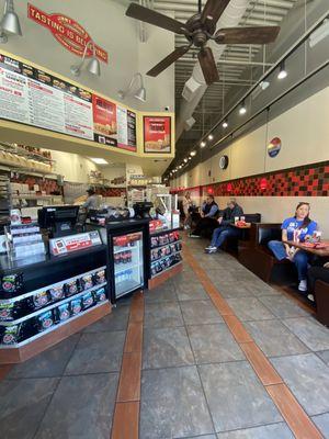 ONE rude employee, multiple people waiting, phones are ringing constantly.