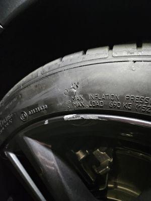 Left Front Drivers Tire damage from car wash right above rim damage