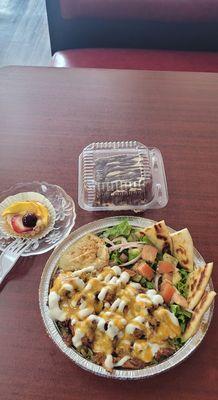 Homemade chicken rice hummus pita dish, homemade tarts, and homemade chocolate cake
