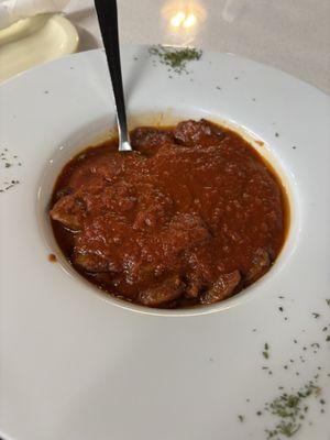 Sausage ( it's under the sauce )