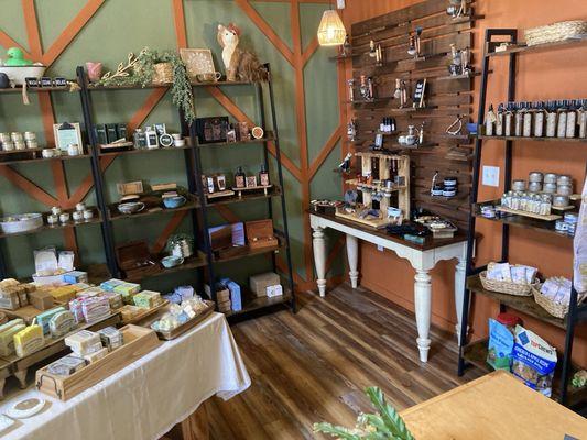 Locally made soaps on table (left), locally made shaving brushes/razors on table in back.