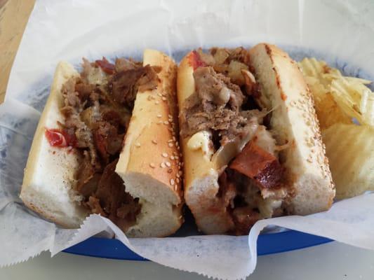 Bacon Cheesesteak with pepper Jack cheese and fried Os' on a seeded roll