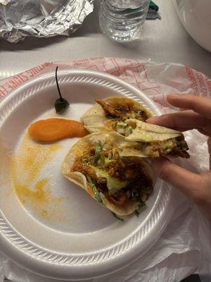 Half eaten tacos. I ordered 2 pollo 3 al pastor.