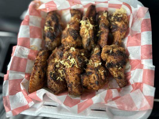 Them grilled lemon pepper wings with grated lemon on top