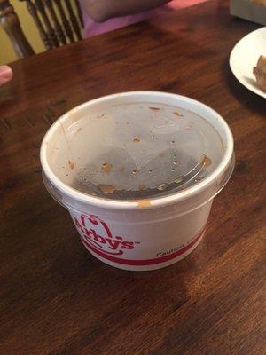 My wife ordered a half-pound French dip and they gave her about 2 ounces of au jus in this giant container.