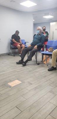 Just one corner of a very crowded waiting room.