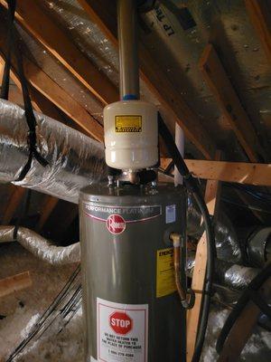 Rheem Performance Plus 12 year 40 gal natural gas water heater installed by Sweetwater Home Services, trusted partner of Home Depot
