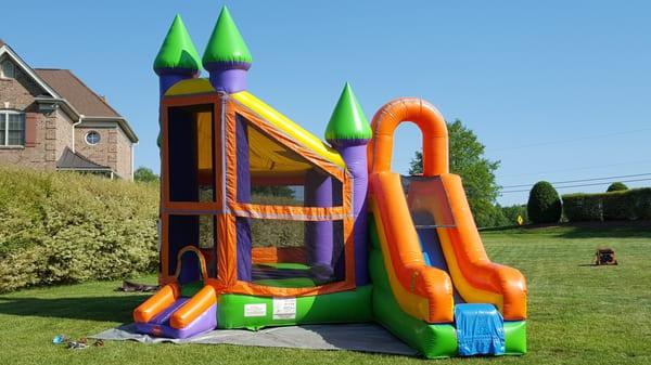 Our Deluxe Castle Combo unit is the largest combination Bounce House and Slide we have!