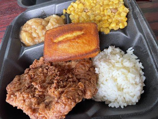 Fried Pork Chop. Mashed potatoes. Corn. Cornbreadloaf