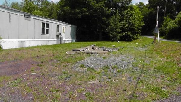 Lovely homesites, complete with broken concrete & debris, and abandoned trailer neighbors.